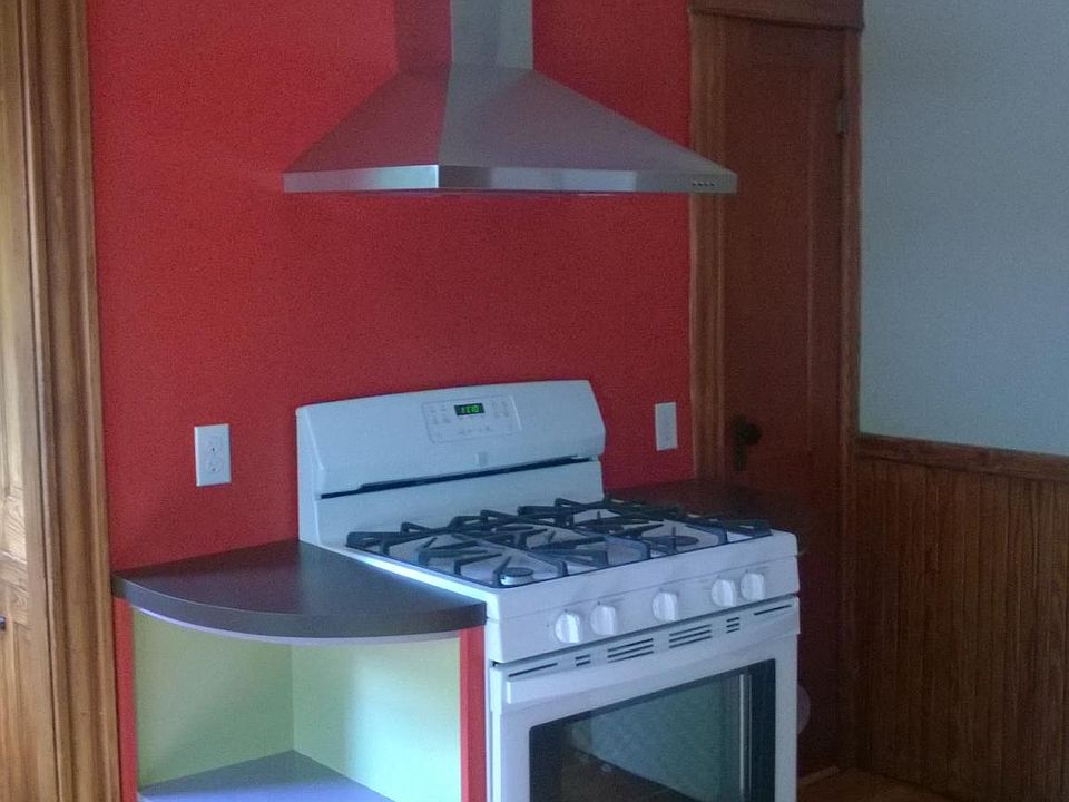 Gas range, self cleaning oven. Pantry to right of stove. Vintage ceiling fixture.