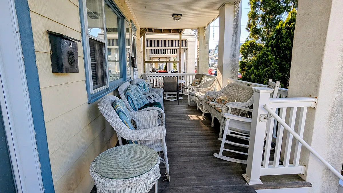 Table for wonderful outdoor dining at end of porch. - 61 Cookman Ave #1