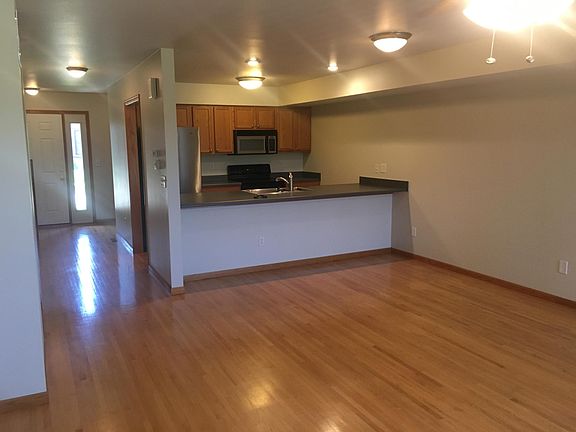 View of kitchen and entrance from the living room on main le
