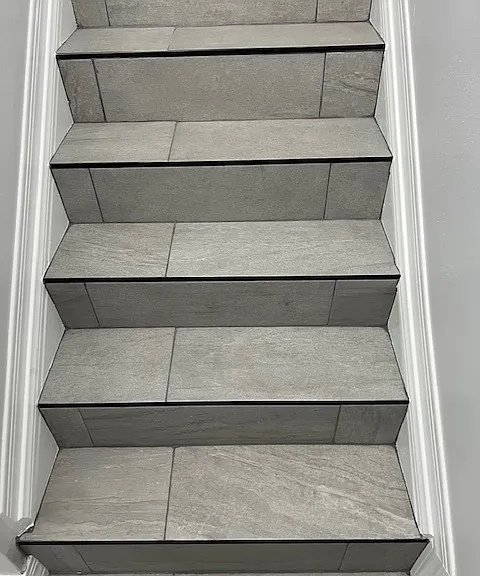 Stairwell, Brand New Tile and Grout, New Baseboard and Molding, Handrails, Chandelier Light. Freshly Painted Ceiling, Walls, New Baseboards and New Moldings.