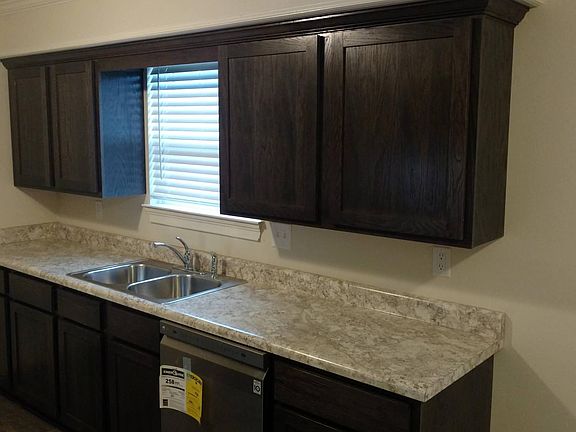 Stainless steel double sink with Delta faucet.