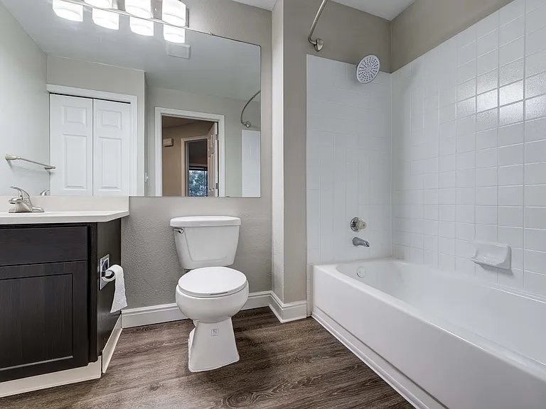 Modern apartment with in-unit laundry featuring a laundry closet with washer and dryer, perfect for convenient living.