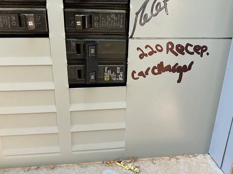 electric car charger ready for short or long cord provided by tenant