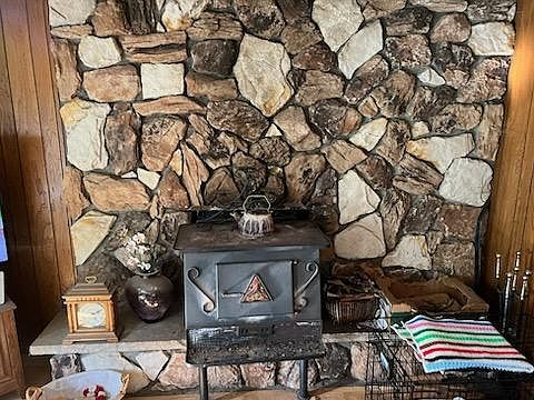 Living room stove and rock wall. Rock accents in other areas