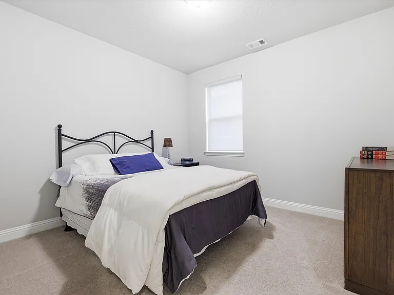 Experience exceptional comfort in this large secondary bedroom, designed to offer an elevated retreat for family members or guests with walk-in closet and private bathroom