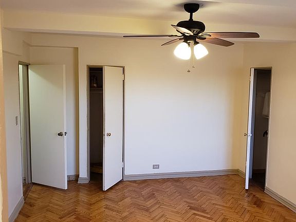 Bedroom with numerous closets