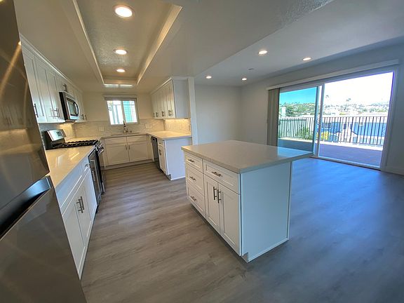 Completely remodeled kitchen, flooring, recessed lighting and new windows.