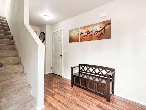 Entrance welcoming you home! Stairs to the left, garage door in the middle and hallway on the right. Outside of this picture to the far right is the 1/2 bath downstairs.