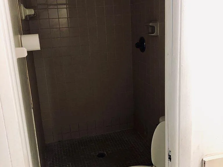 SHOWER/BATHROOM. . OTHER BATHROOM HAS TUB AND SHOWER