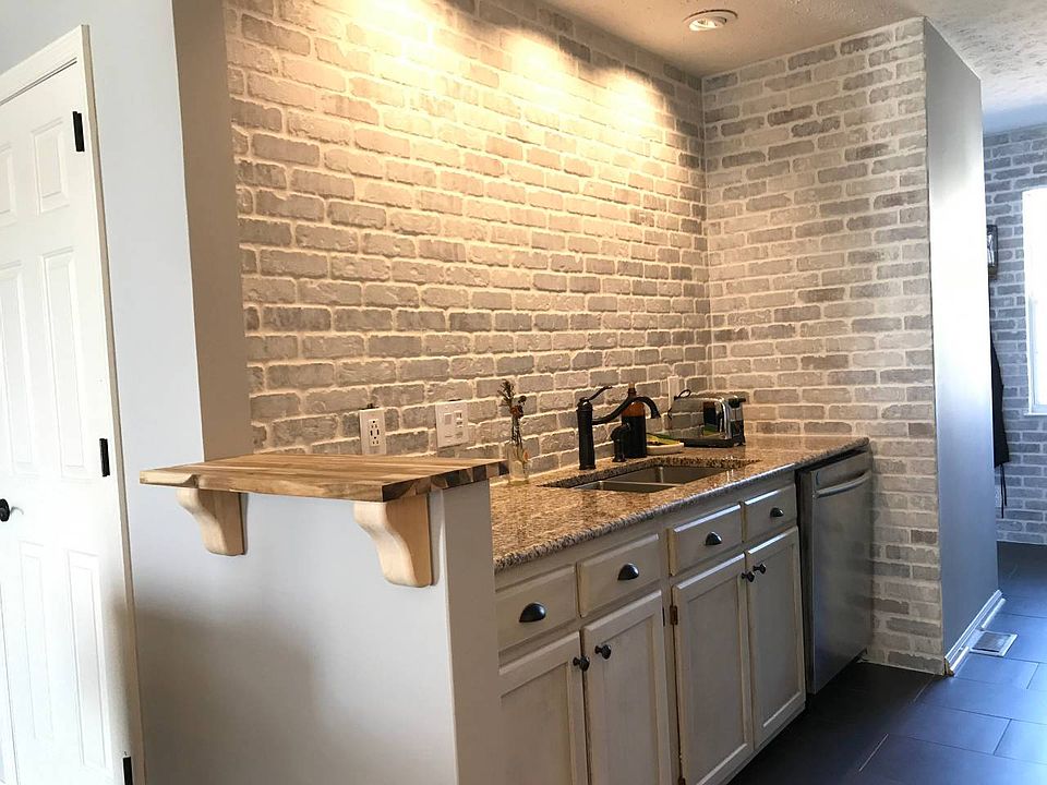 Washed brick backsplash.