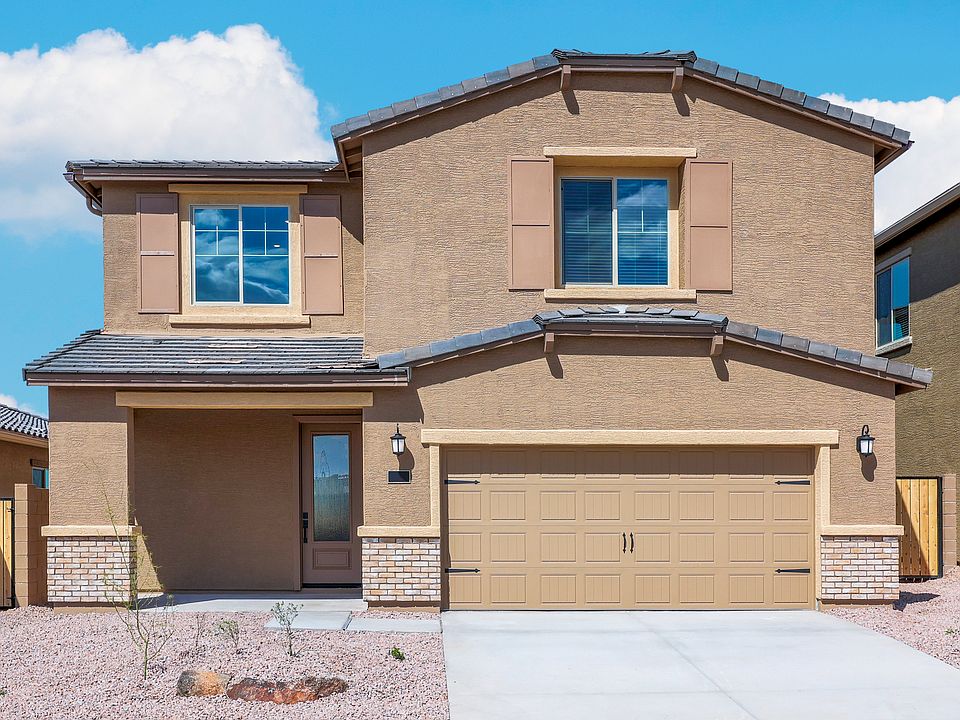 Exterior of the Snowflake with a covered front porch and 3 4 lite door.