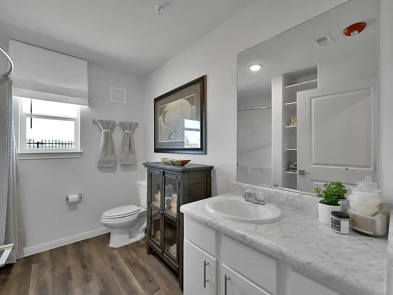 Experience the contemporary elegance of Esperanza at Wild Orchid. This pristine bathroom features modern finishes, ample storage, and a bright, inviting atmosphere. Transform your living experience todayschedule your tour now!