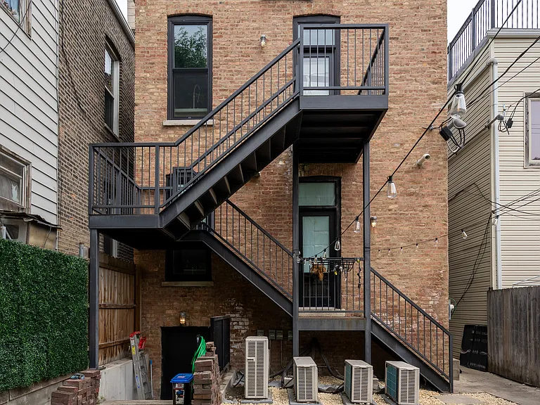 Community patio, with studio entrance. Bottom door is entrance to the studio.