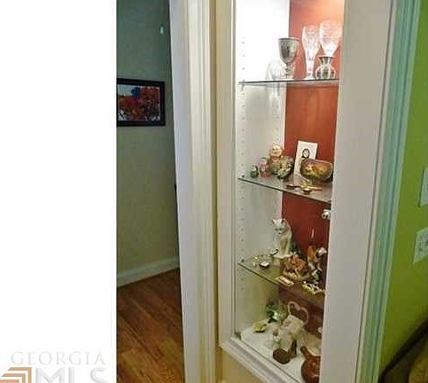 Beautiful built-in display cases between the entry foyer and the living room.