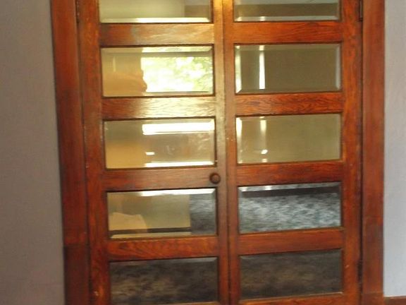 Beveled glass doors to 1st floor bedroom