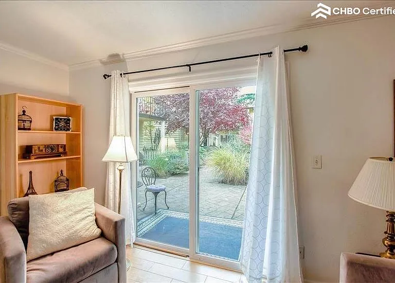 Living room with sliding glass doors out to patio