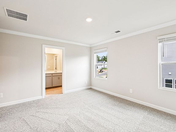 The primary bedroom leads to your own personal ensuite.