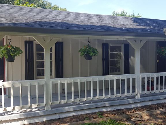 Front Porch Entry. Front porch has black and teal patio set included.
