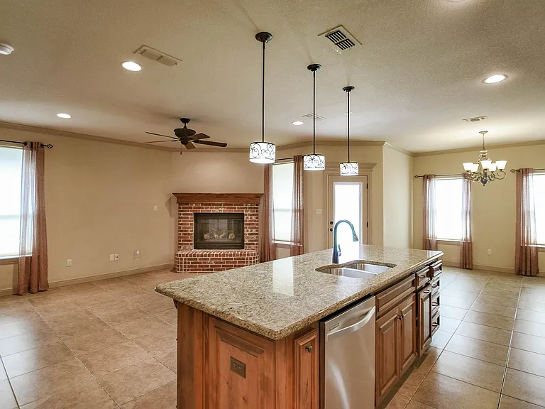Kitchen features granite counters and stainless steel appliances