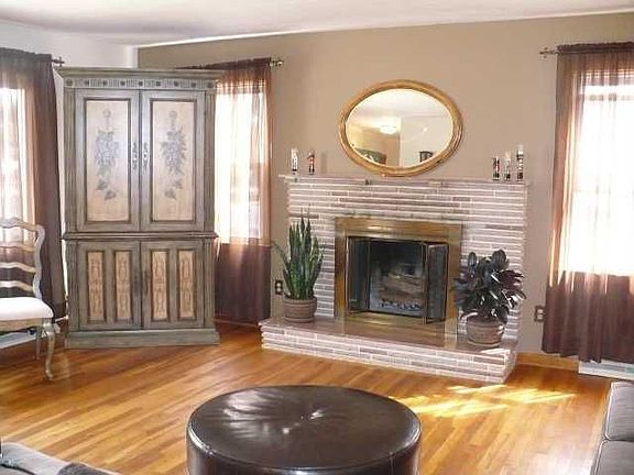 Living Room: Hardwood Floors And Large Fireplace With Lots Of Windows!