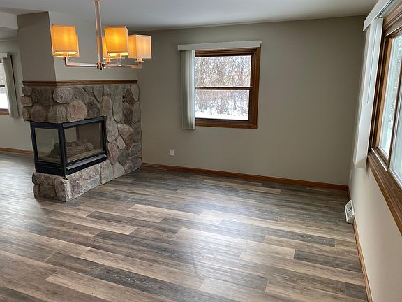 Dinette, new laminate wood flooring and gas fireplace