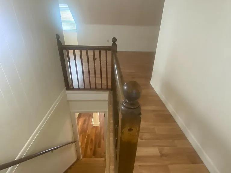Stairs to second floor bedroom (door on first floor)