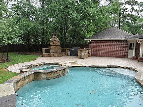 Incredible oversized and private lot with fabulous pool , outdoor fireplace and kitchen. Great place