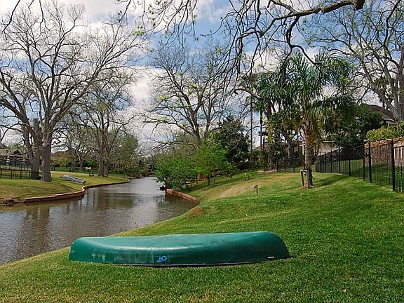 Here is a lovely view of meandering Pecan Lake.  Gorgeous trees, verdant green lawns and peaceful waterways provide a sublime escape from the hectic pace of the city.