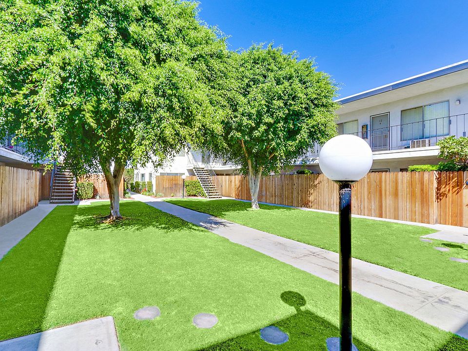 Lush Landscaping courtyard with 2 large trees
