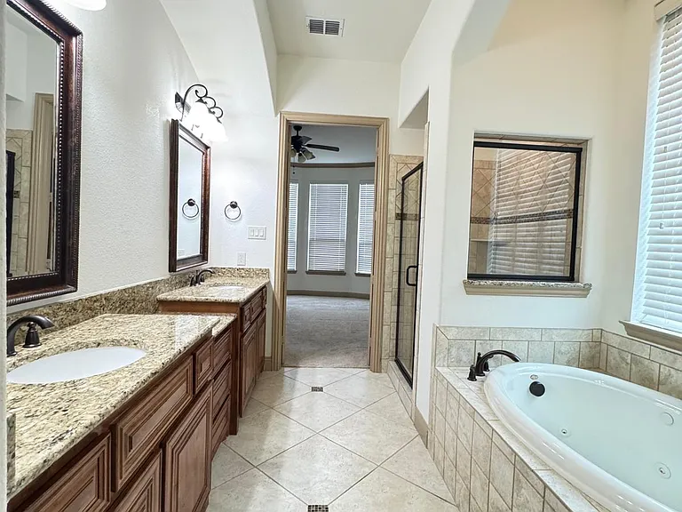 Masterbath with the view of the bathtub and standup shower
