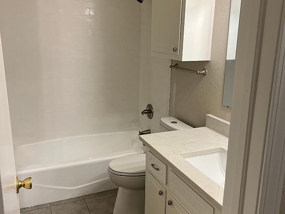 new shower and fixtures in hall bath. brushed nickel finishes