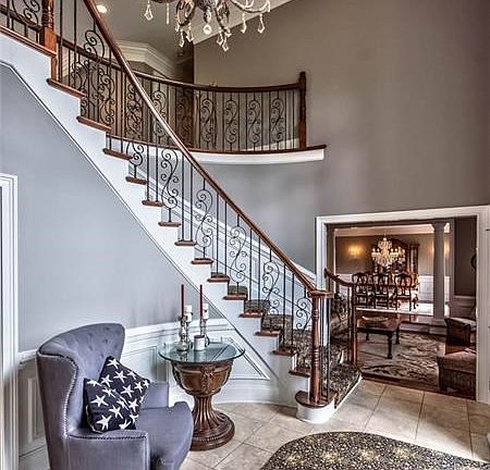 Welcome guest in this gorgeous 2 sty foyer highlighted w/tray ceiling, impressive chandelier (on lift), curve staircase & limest