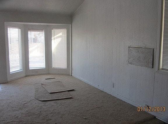 Large Living Room; Carpet has been replaced with tile floors.