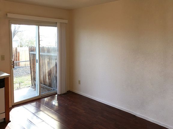 Dining area with sliding door to fenced backyard. Not pictur