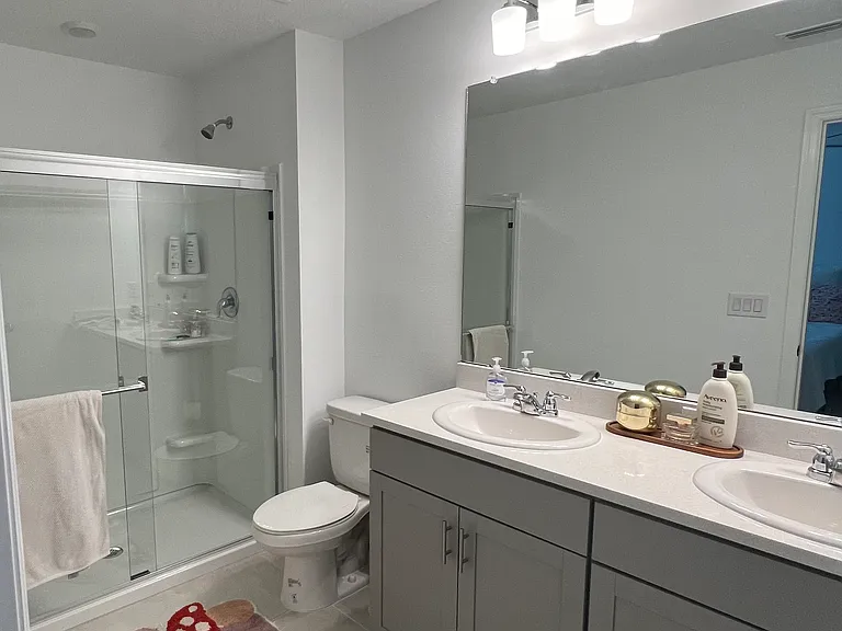 Master Ensuite Bathroom. Dual sinks, walk in shower. Plenty of under sink storage.