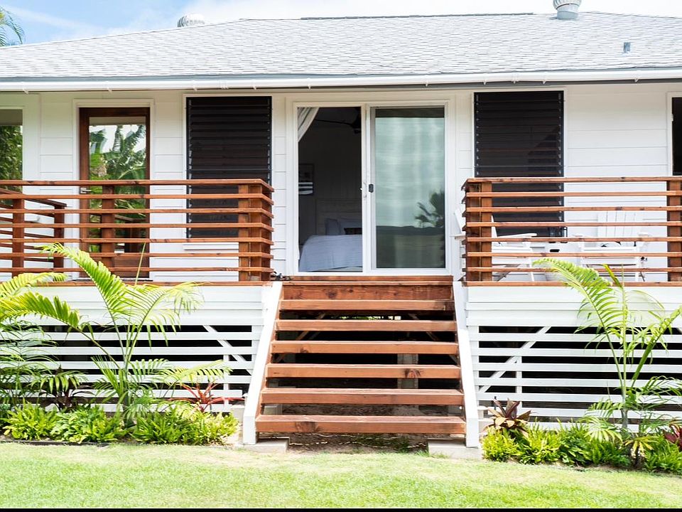 back deck/back yard area. sliding door access the master bedroom. door yo our far right is the kitchen.