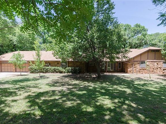 Large 3 bed home with two large living areas AND a sunroom! You'll enjoy this wooded retreat on well and septic, located in Deer Creek Schools.
