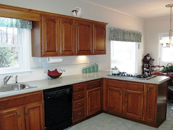 Remodeled Kitchen w/hardwood cabinetry & Corian