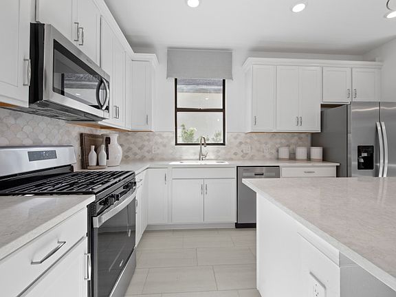 White kitchen cabinets and designer finishes