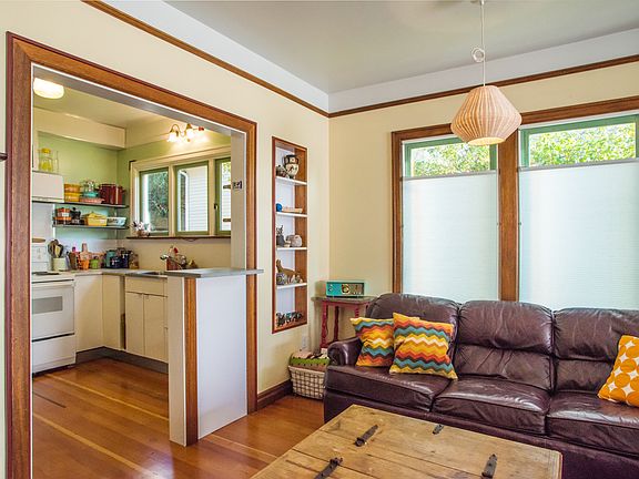 Living room/dining room. There is a small standup bar.