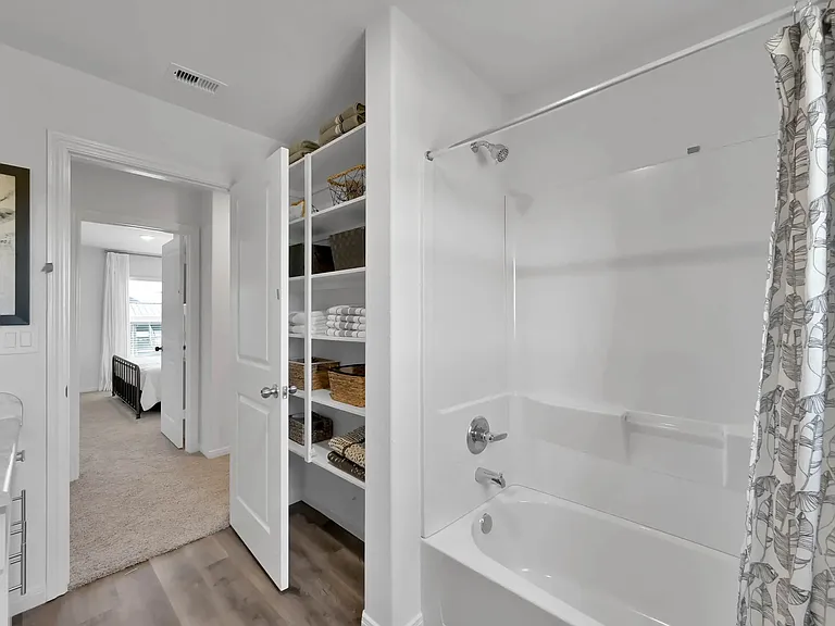 Experience the modern elegance of Esperanza at Wild Orchid. This spacious bathroom features sleek finishes and ample storage, creating a serene retreat for relaxation. Explore our exceptional amenities and schedule your tour today!