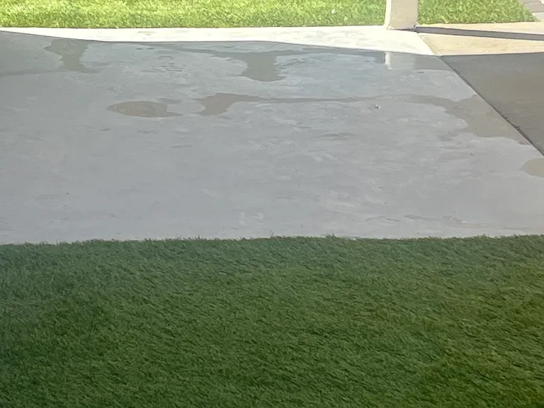 Back yard with synthetic grass.
