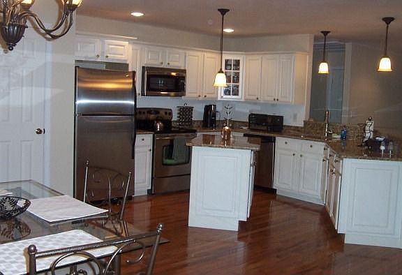 Beautiful Granite Counters highlighted with Comtemporary lighting