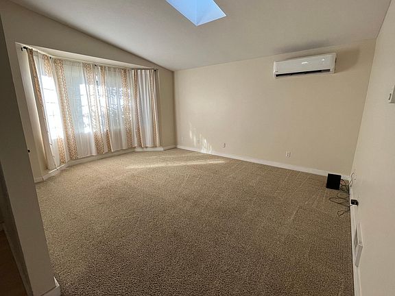 Living room with ductless heating and cooling, skylight