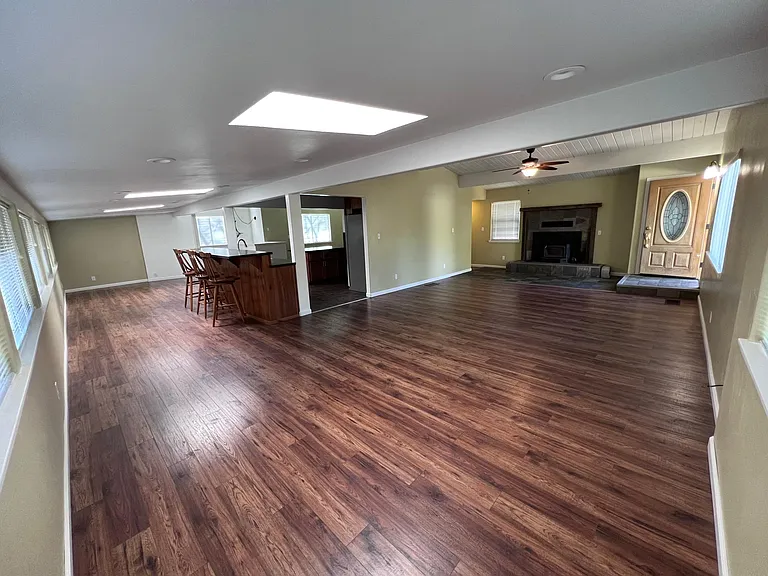 Enter front door to the expansive living room