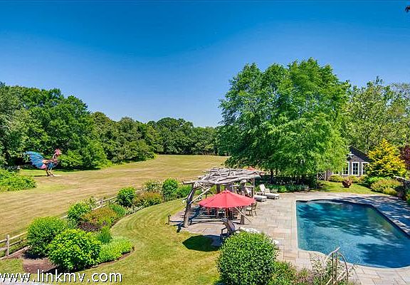 Looking over the pool towards the pond from the roof deck