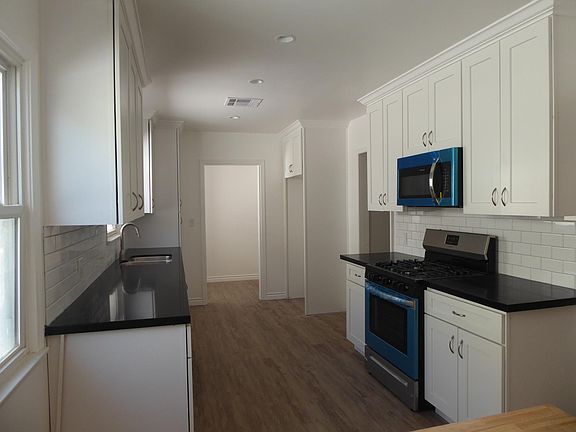 All new cabinets, stone tops, appliances, plumbing fixtures, tile backsplash