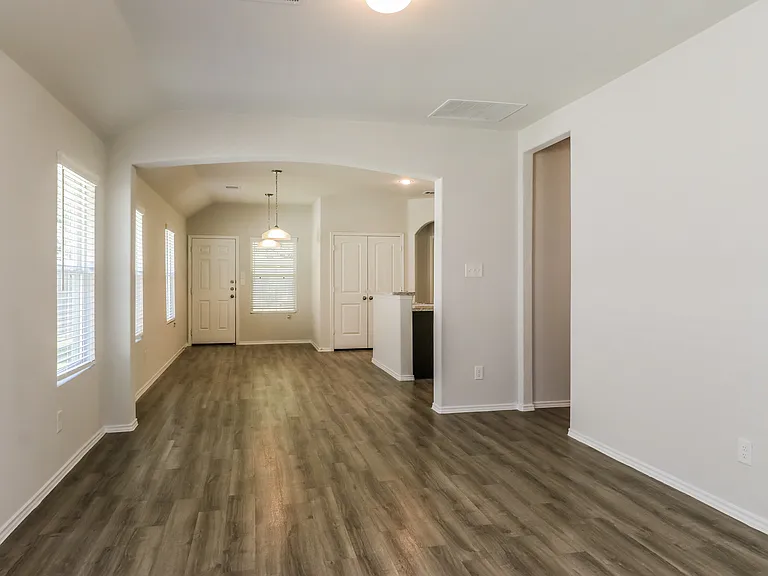 Inviting open-concept living space with elegant hardwood floors and abundant natural light. Inviting open-concept living space with elegant hardwood floors and abundant natural light.