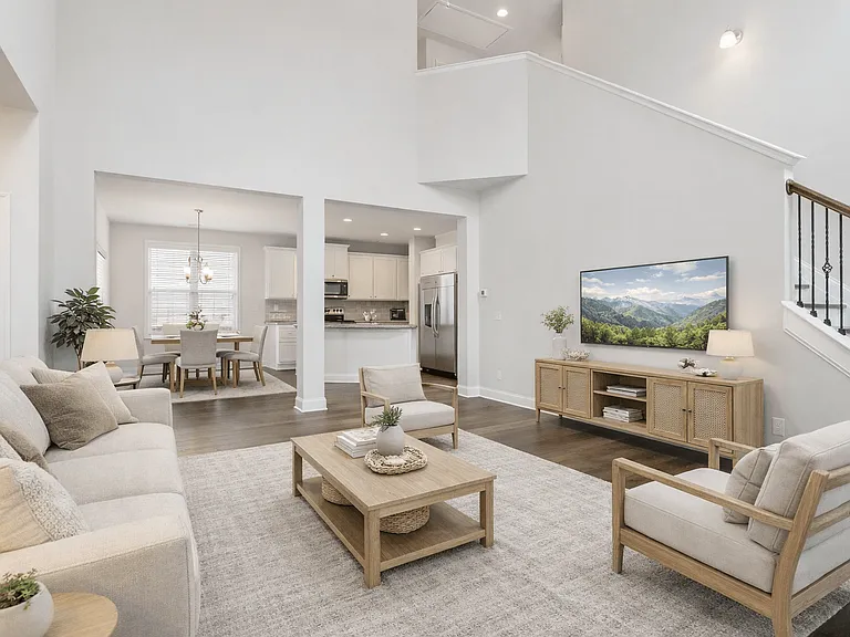 A view of the spacious living space and kitchen