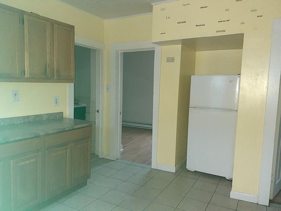 other side of kitchen It is painted grey not yellow older picture to show kitchen